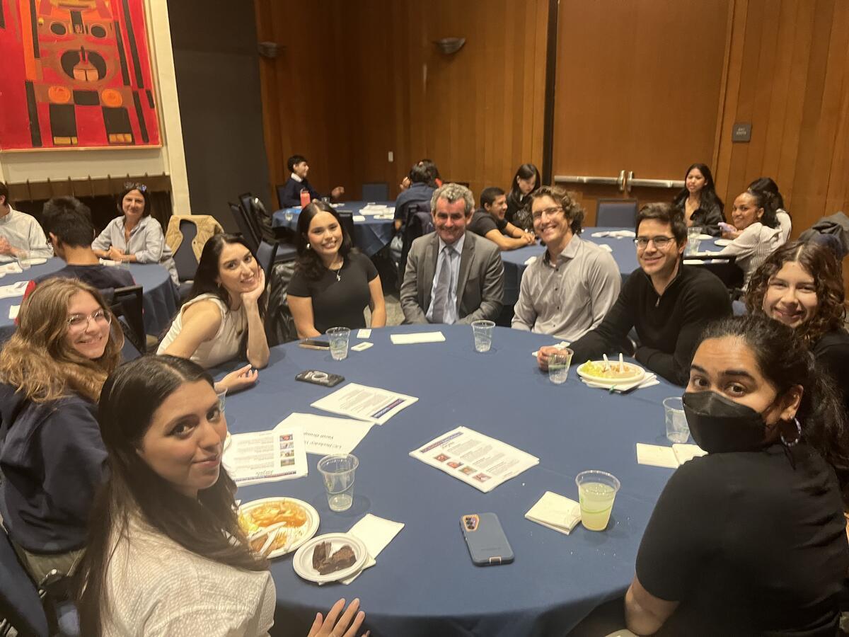 yardi scholars sitting at round table with vice provost oliver o'reilly