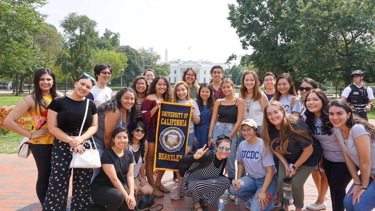 2018 ucdc students posing with a uc berkeley banner